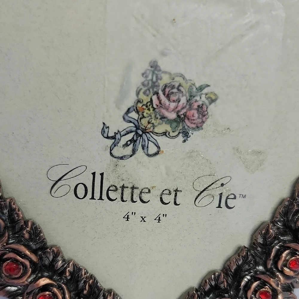 Heart-Shaped Bronze Frame with Red Accents